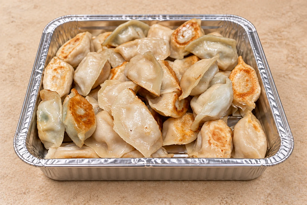 Dumpling Chef mixed pan-fried dumplings in a catering tray