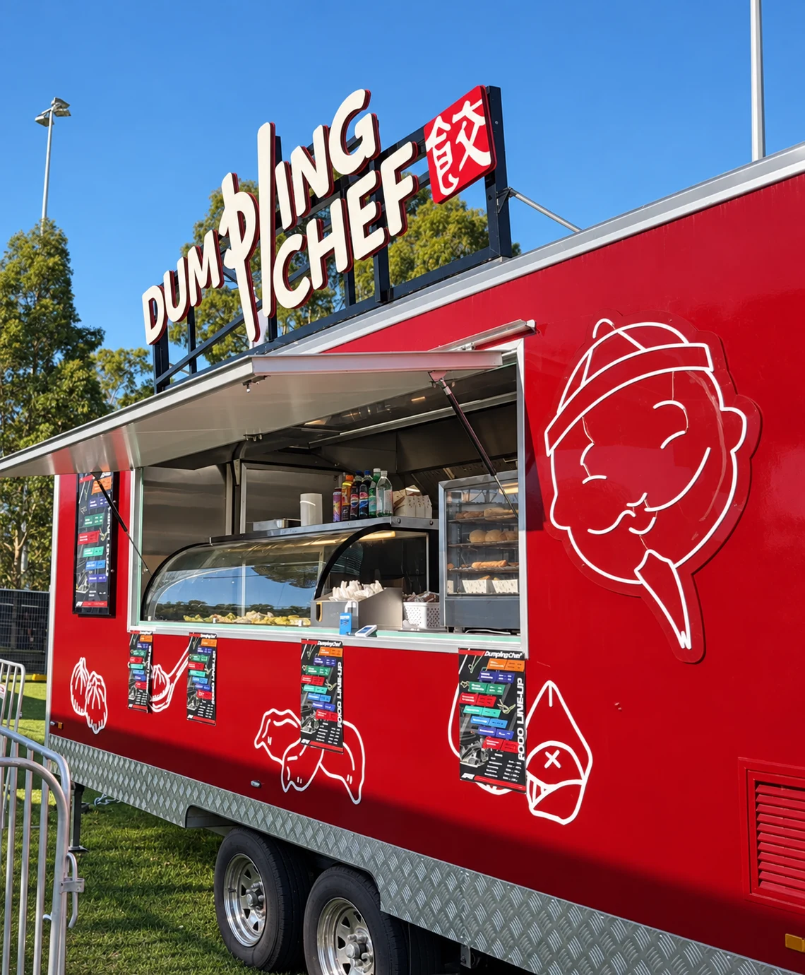 Red Dumpling Chef food trailer with rooftop sign and open serving counter